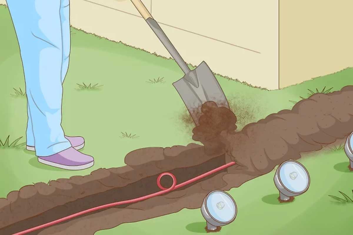 قدم آخر نصب چراغ دفنی: خاک ریختن روی سیم کشی